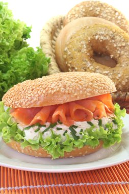 Bagel with cream cheese and salmon clipart