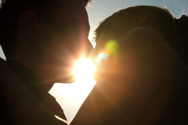 Young couple kissing clipart