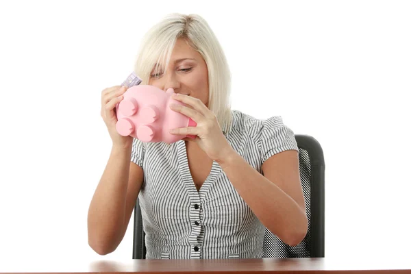 Woman with pink piggy bank — Stock Photo, Image