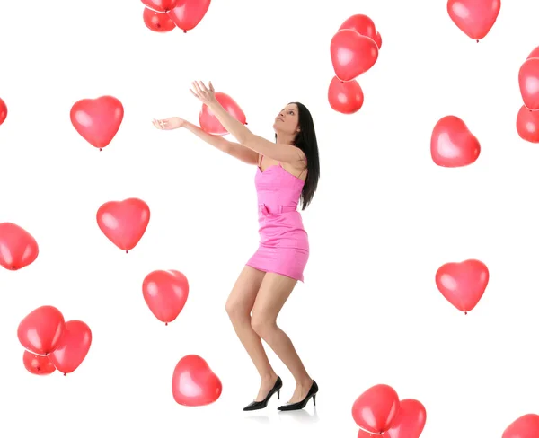 Vacker ung kvinna med rött hjärta ballong — Stockfoto