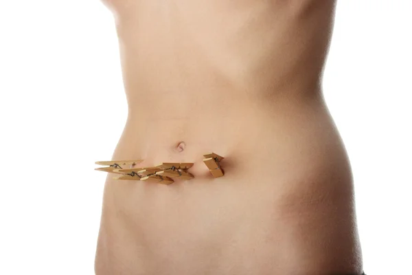 Clothespin on belly — Stock Photo, Image