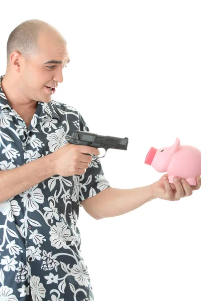 Mand med pistol peger på sparegris bank - Stock-foto