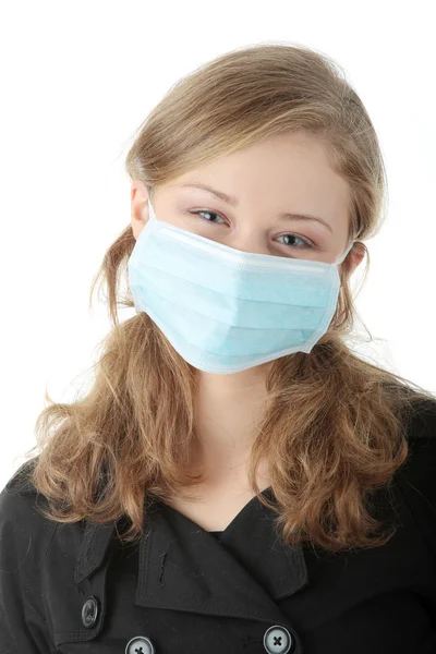 Модель в маске, чтобы предотвратить "свиной грипп" — стоковое фото