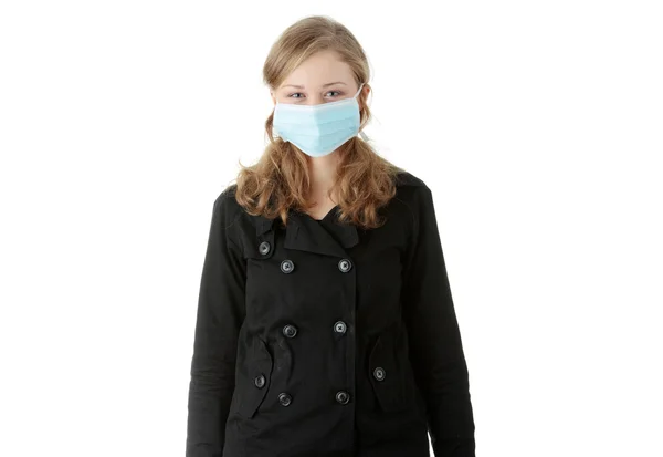 Un modello che indossa una maschera per prevenire l'influenza suina — Foto Stock