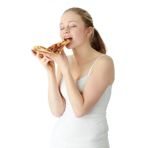 Gelukkig jongedame eten van pizza — Stockfoto