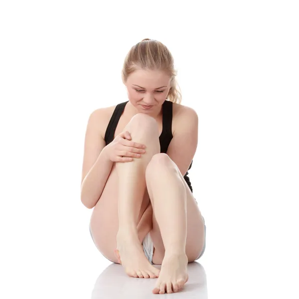 Woman experiencing leg cramp — Stock Photo, Image