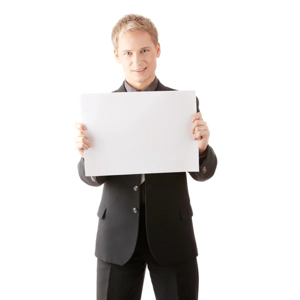 Young businessman holds blank signs. — Stock Photo, Image