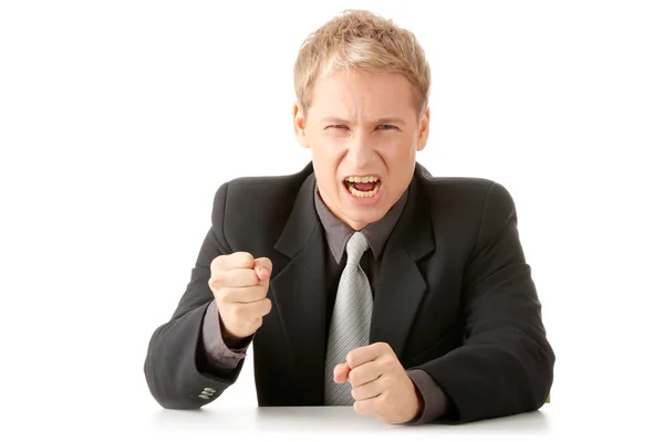 Young businessman sitting behind the desk — Stock Photo, Image