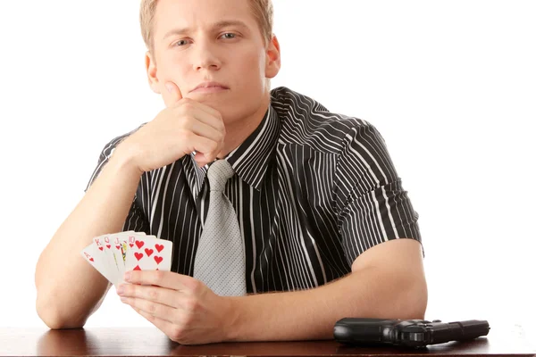 Joven jugador de poker con pistola — Foto de Stock