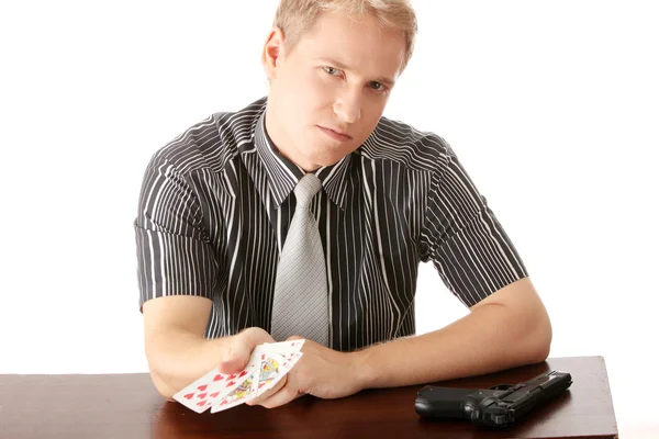 Young poker player with gun — Stock Photo, Image