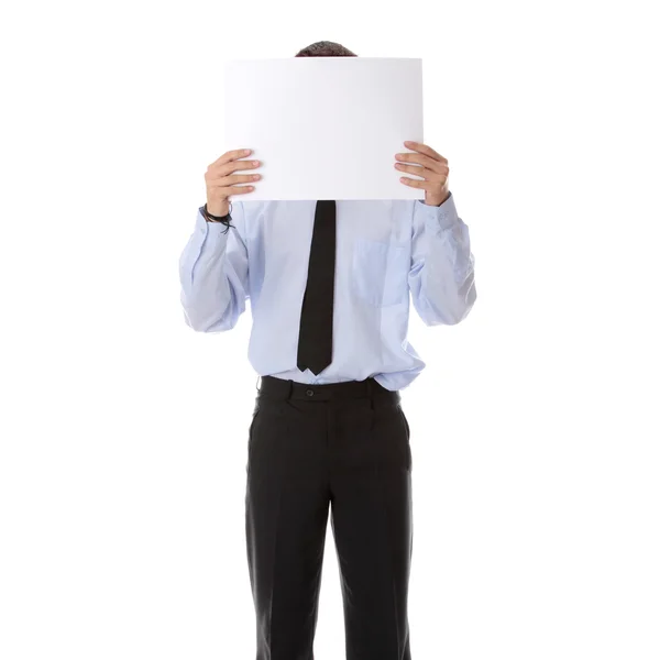 Uomo d'affari con una carta bianca in faccia — Foto Stock