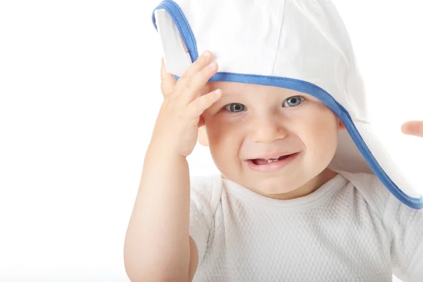 Dítě se snaží na lapačku cap — Stock fotografie