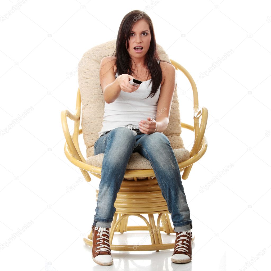 Young woman watching TV - scared Stock Photo by ©piotr_marcinski 3135532