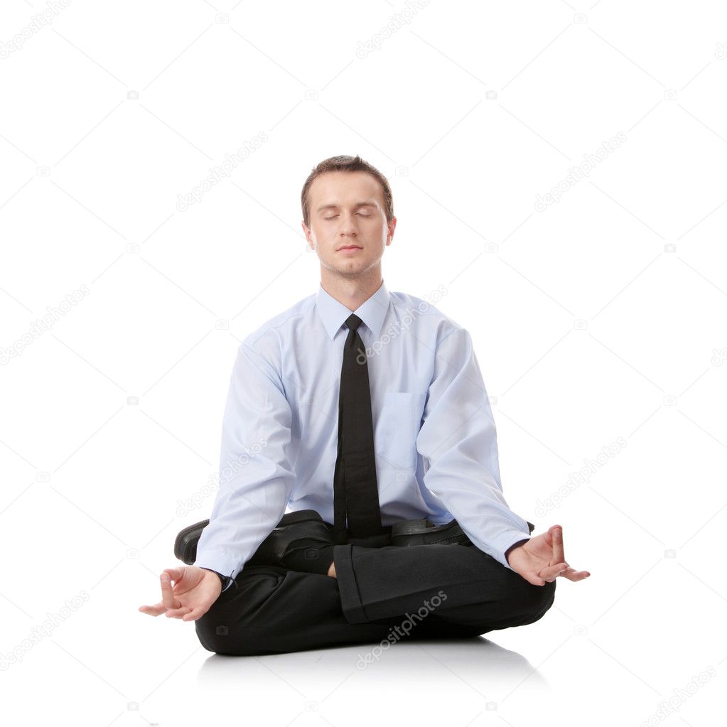 Businessman sitting in lotus position