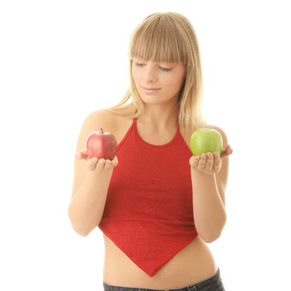Young blond woman with red and green apples — Stock Photo, Image