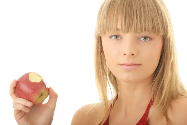Νεαρή ξανθιά γυναίκα με κόκκινο μήλο — Φωτογραφία Αρχείου