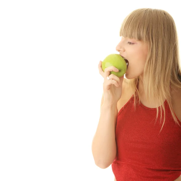 Młoda blond kobieta z zielonym jabłkiem — Zdjęcie stockowe