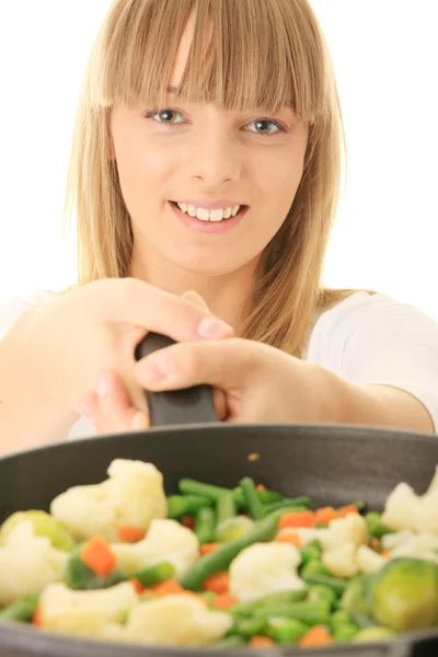 Young woman cooking food — Stock Photo, Image