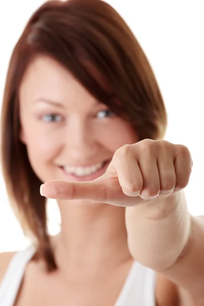 Casual woman smiling with her thumbs making deci — Stock Photo, Image