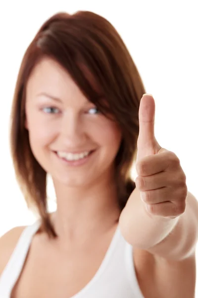 Příležitostné žena s úsměvem s palci nahoru — Stock fotografie