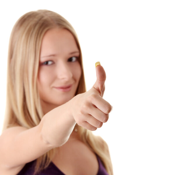 Casual woman smiling with her thumbs up - isolat