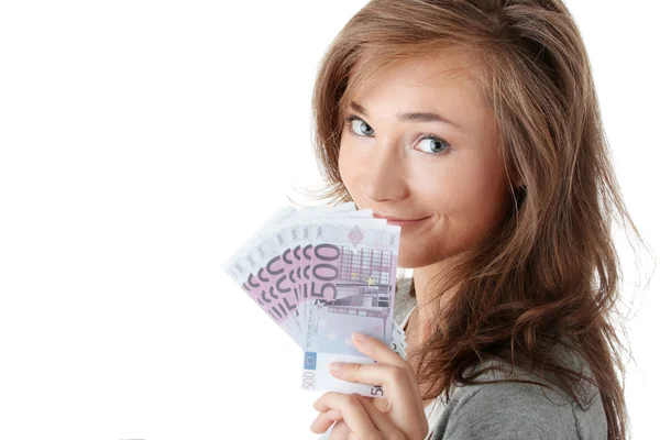Женщина, держащая евро счета и модель дома — стоковое фото