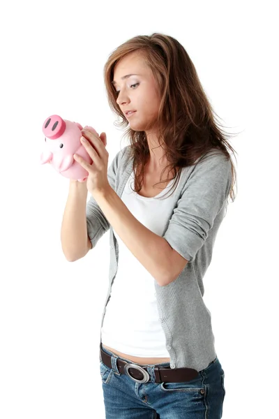 Young beautiful woman standing with piggy bank — Stock Photo, Image