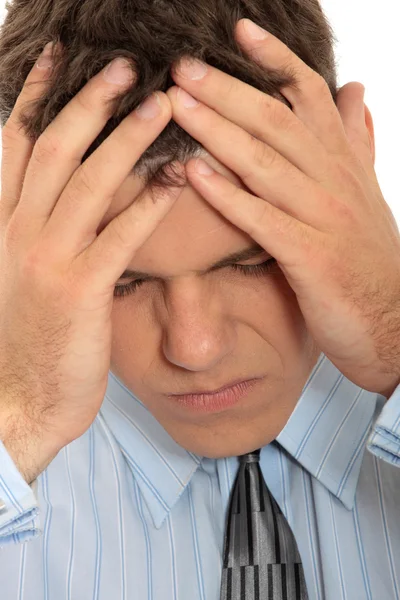 Empresário com uma grande dor de cabeça — Fotografia de Stock
