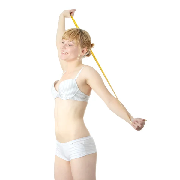 Sexy, em forma, jovem mulher medindo — Fotografia de Stock