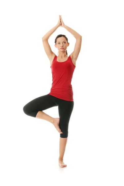Mujer joven haciendo ejercicio de yoga —  Fotos de Stock