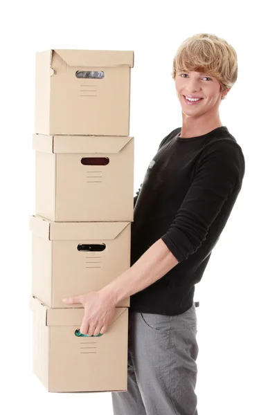 Homem com caixas empilhadas — Fotografia de Stock