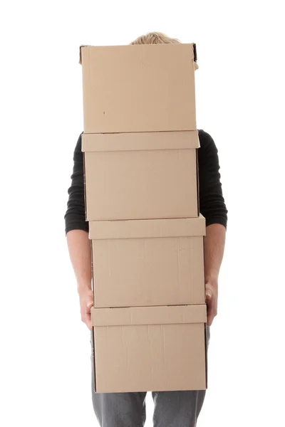 Homem com caixas empilhadas — Fotografia de Stock