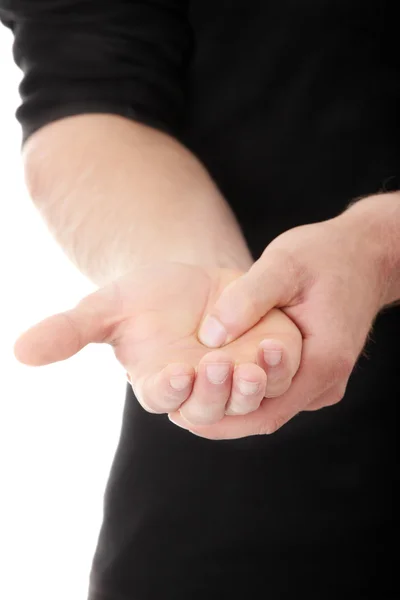Homem segurando sua mão — Fotografia de Stock