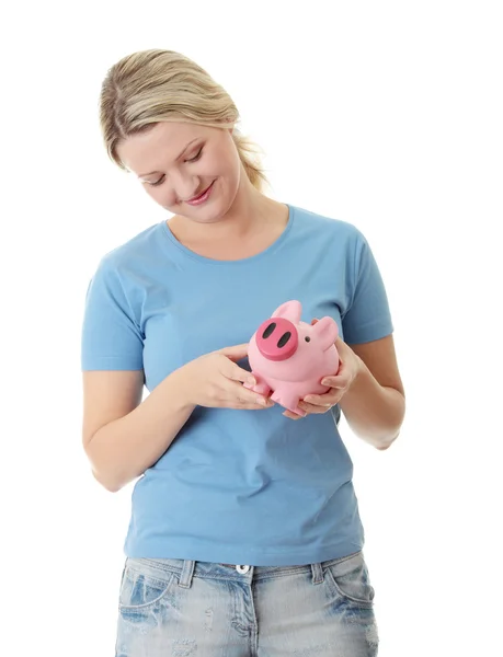 Trying to get money from piggy bank — Stock Photo, Image