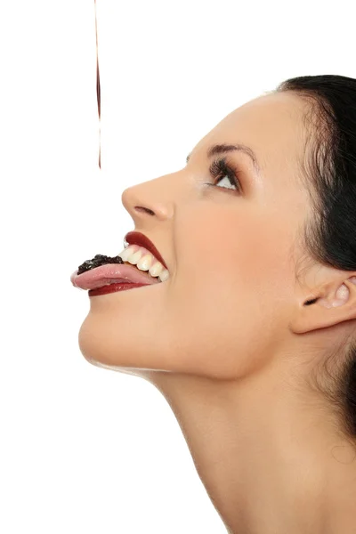 Woman eating chocolate — Stock Photo, Image