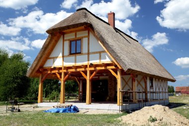 Unfinished, ecological wooden house and building area clipart