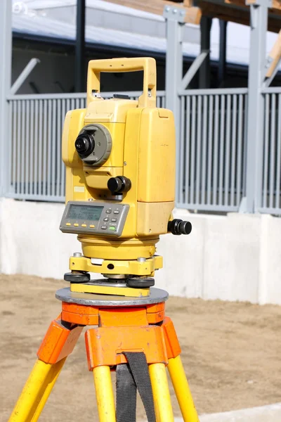 Yellow theodolite on a construction site — Stock Photo, Image