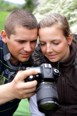 Photographer shows camera shot girl clipart