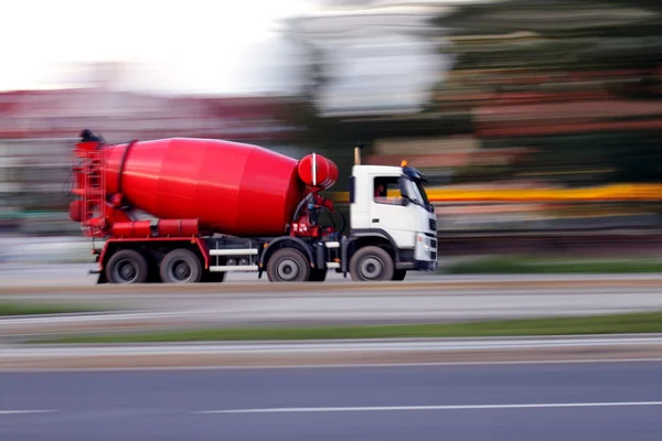 Blur red concrete mixer is going to build soon — Stock Photo, Image