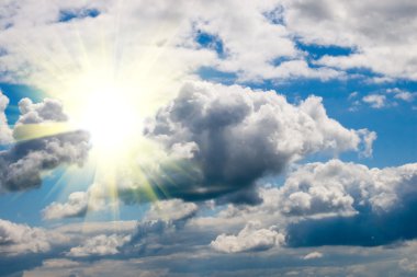 Bright sun and white clouds clipart