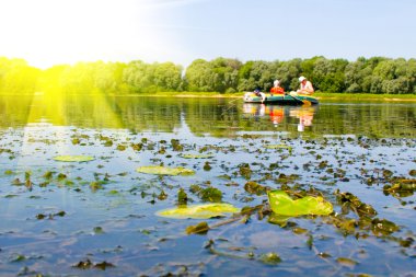 Rubber boat on the river clipart