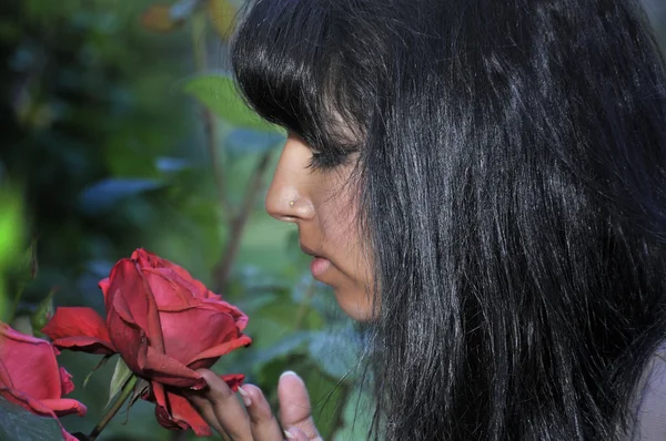 Woman Smelling a Flower — Stock Photo, Image