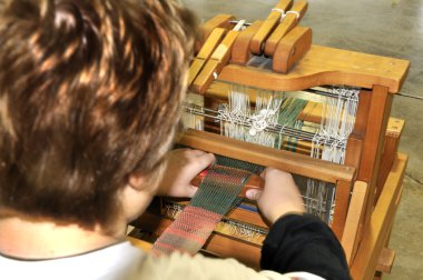 Child Using Loom clipart