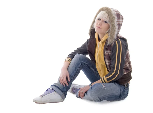 Jeans sentada menina na capa — Fotografia de Stock