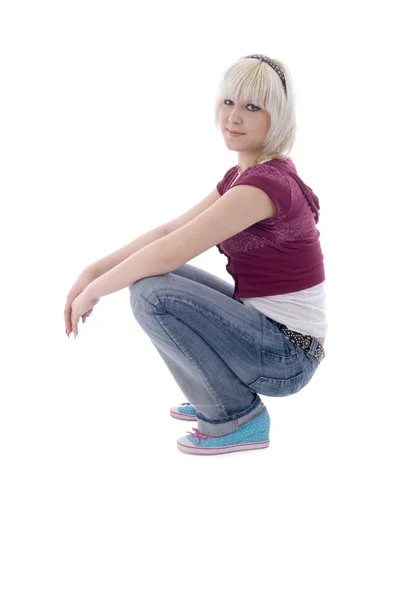 Sitting Jeans Blonde Girl. Side View. — Stock Photo, Image