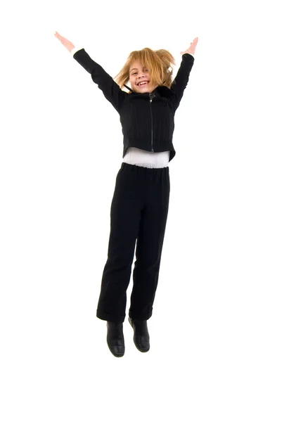 Aranyos iskoláslány jumping az öröm. — Stock Fotó