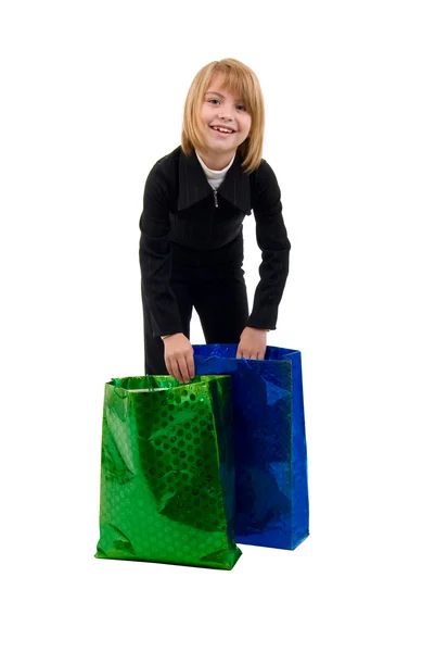 Flickan med två kassar och påsar. — Stockfoto