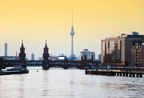 Berlin oberbaumbrucke with tv tower at sunset