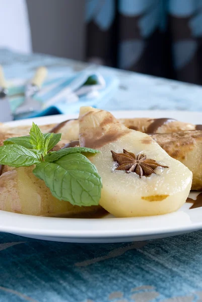 Rolled pancakes with poached pear — Stock Photo, Image
