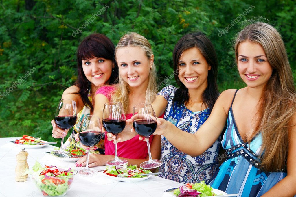 Group of young womens drinking wine — Stock Photo © yekophotostudio ...